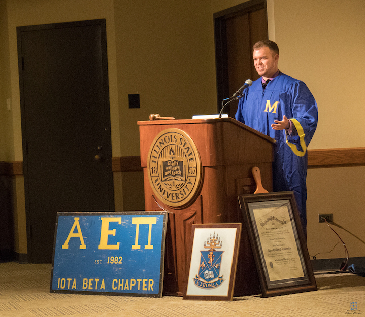 Illinois State Chartering Master Ethan Shemoney (2018) makes an acceptance speech after receiving the charter.