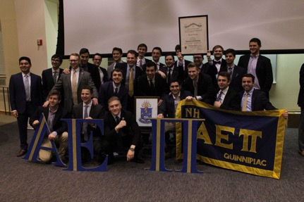 Quinnipiac University Chartering Nu Eta Brothers pose for a group photo after receiving their charter.
